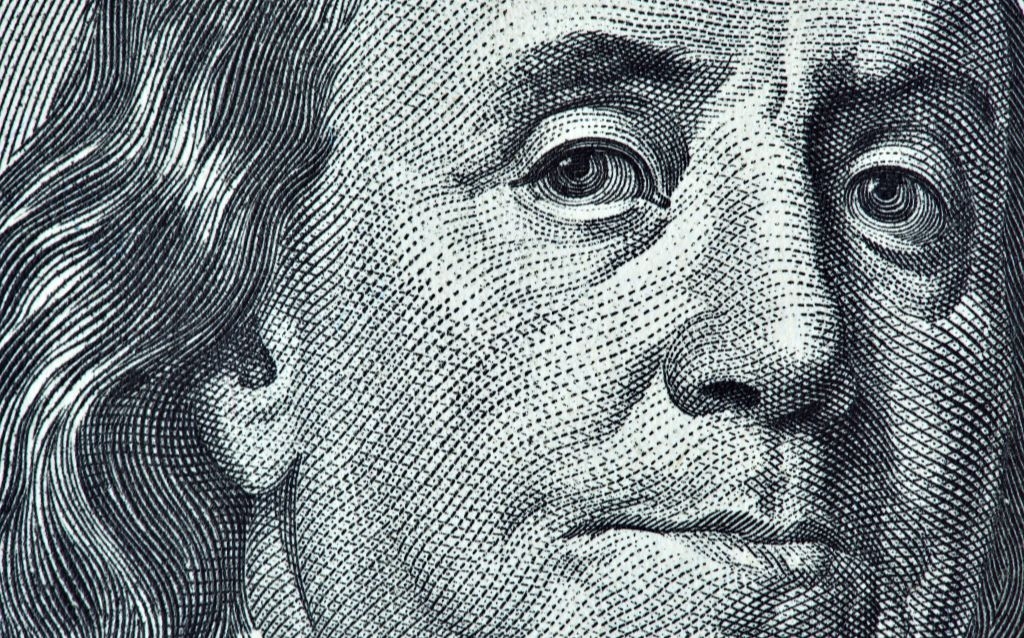 renda fixa em dólar imagem de uma nota de dólar com zoom no rosto que aparece na cédula